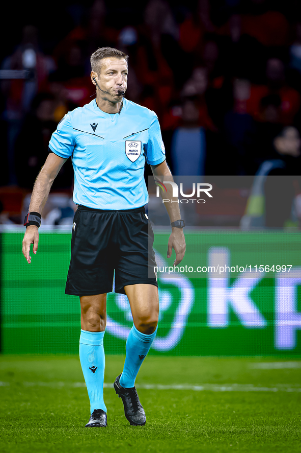 Referee Davide Massa officiates the match between the Netherlands and Germany at the Johan Cruijff ArenA for the UEFA Nations League, League...