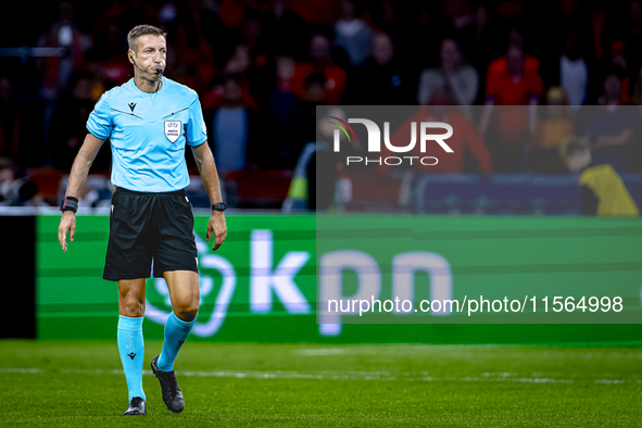 Referee Davide Massa officiates the match between the Netherlands and Germany at the Johan Cruijff ArenA for the UEFA Nations League, League...