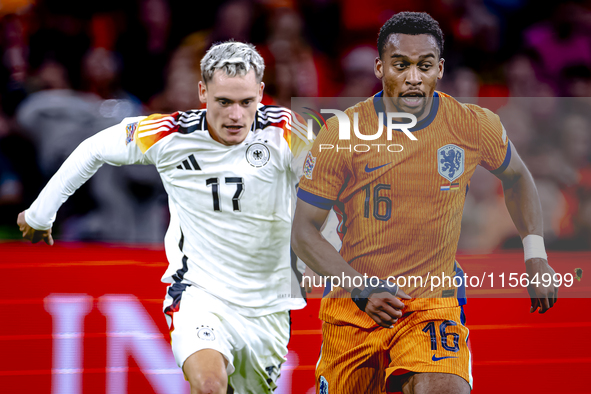 Germany midfielder Florian Wirtz and Netherlands midfielder Quinten Timber during the match between the Netherlands and Germany at the Johan...