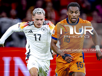 Germany midfielder Florian Wirtz and Netherlands midfielder Quinten Timber during the match between the Netherlands and Germany at the Johan...