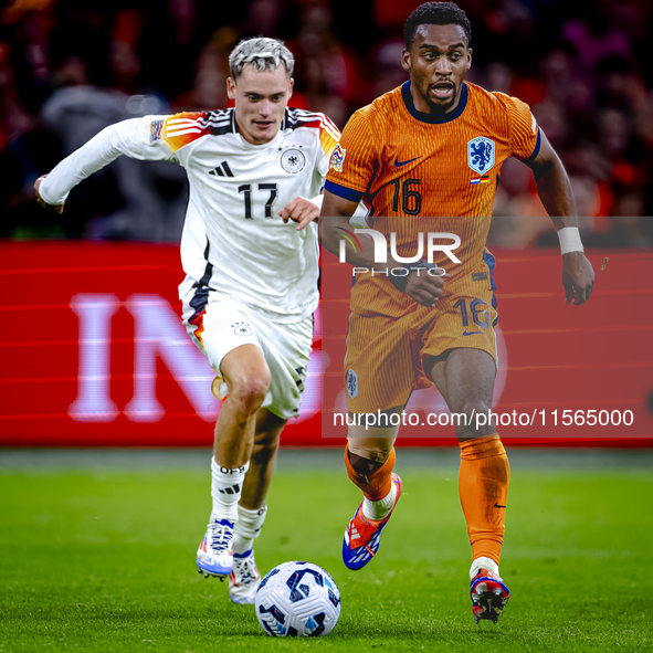 Germany midfielder Florian Wirtz and Netherlands midfielder Quinten Timber during the match between the Netherlands and Germany at the Johan...