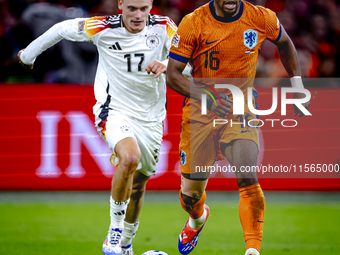 Germany midfielder Florian Wirtz and Netherlands midfielder Quinten Timber during the match between the Netherlands and Germany at the Johan...