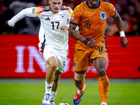 Germany midfielder Florian Wirtz and Netherlands midfielder Quinten Timber during the match between the Netherlands and Germany at the Johan...