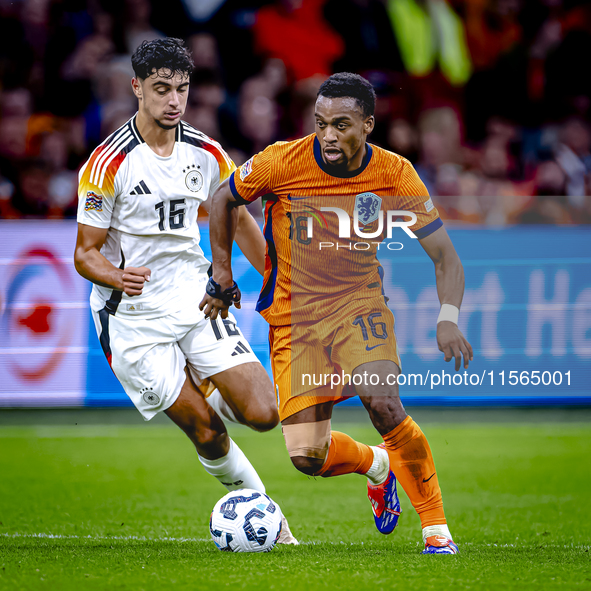 Germany midfielder Aleksander Pavlovic and Netherlands midfielder Quinten Timber during the match between the Netherlands and Germany at the...