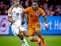 Germany midfielder Aleksander Pavlovic and Netherlands midfielder Quinten Timber during the match between the Netherlands and Germany at the...