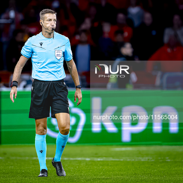 Referee Davide Massa officiates the match between the Netherlands and Germany at the Johan Cruijff ArenA for the UEFA Nations League, League...