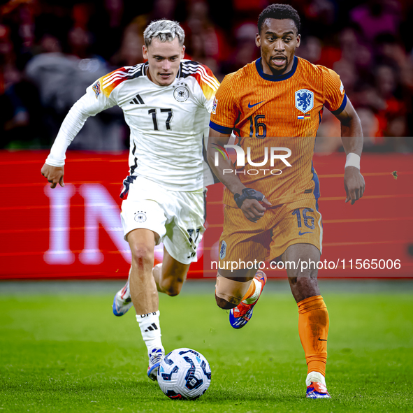 Germany midfielder Florian Wirtz and Netherlands midfielder Quinten Timber during the match between the Netherlands and Germany at the Johan...