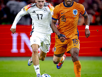 Germany midfielder Florian Wirtz and Netherlands midfielder Quinten Timber during the match between the Netherlands and Germany at the Johan...