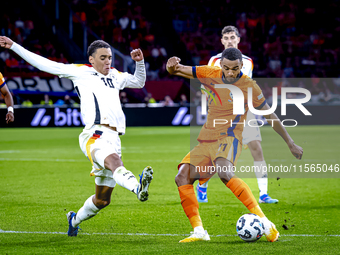 Germany midfielder Jamal Musiala and Netherlands forward Cody Gakpo during the match between the Netherlands and Germany at the Johan Cruijf...