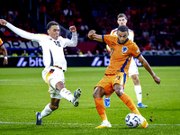 Germany midfielder Jamal Musiala and Netherlands forward Cody Gakpo during the match between the Netherlands and Germany at the Johan Cruijf...