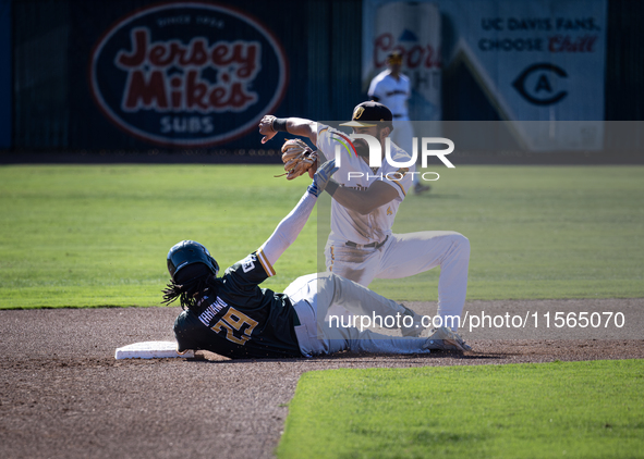 The Yolo High Wheelers (14) beat the Oakland Ballers (4) in game 1 (round 1) of the Pioneer Baseball League's playoffs in Davis, Calif., on...