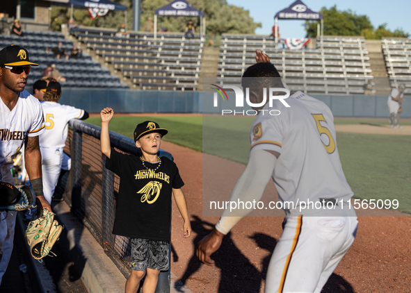 The Yolo High Wheelers (14) beat the Oakland Ballers (4) in game 1 (round 1) of the Pioneer Baseball League's playoffs in Davis, Calif., on...