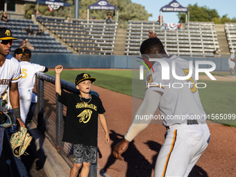 The Yolo High Wheelers (14) beat the Oakland Ballers (4) in game 1 (round 1) of the Pioneer Baseball League's playoffs in Davis, Calif., on...