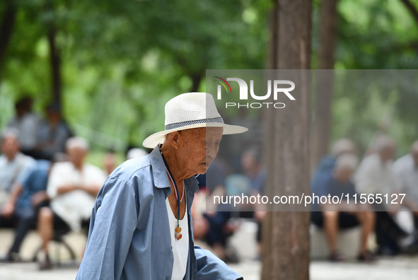 Elderly people relax at a park on Lindai Road in Fuyang, China, on September 11, 2024. 