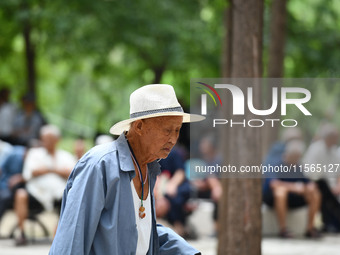 Elderly people relax at a park on Lindai Road in Fuyang, China, on September 11, 2024. (