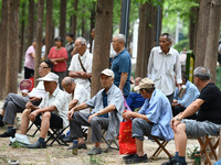 Elderly people relax at a park on Lindai Road in Fuyang, China, on September 11, 2024. (