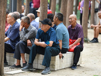 Elderly people relax at a park on Lindai Road in Fuyang, China, on September 11, 2024. (