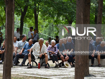 Elderly people relax at a park on Lindai Road in Fuyang, China, on September 11, 2024. (