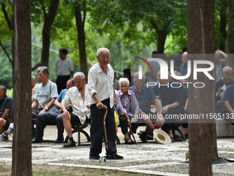 Elderly people relax at a park on Lindai Road in Fuyang, China, on September 11, 2024. (