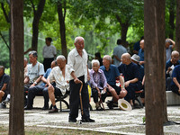 Elderly people relax at a park on Lindai Road in Fuyang, China, on September 11, 2024. (