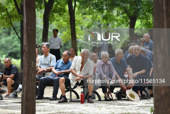 Elderly people relax at a park on Lindai Road in Fuyang, China, on September 11, 2024. 