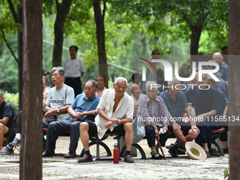 Elderly people relax at a park on Lindai Road in Fuyang, China, on September 11, 2024. (