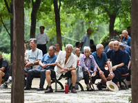 Elderly people relax at a park on Lindai Road in Fuyang, China, on September 11, 2024. (