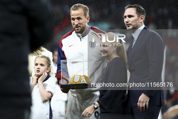 Harry Kane of England receives his 100th cap during the UEFA Nations League Group 2 match between England and Finland at Wembley Stadium in...