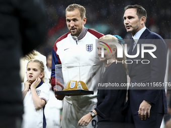 Harry Kane of England receives his 100th cap during the UEFA Nations League Group 2 match between England and Finland at Wembley Stadium in...