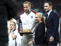 Harry Kane of England receives his 100th cap during the UEFA Nations League Group 2 match between England and Finland at Wembley Stadium in...