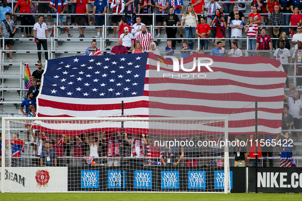 An American flag is seen during the National Anthem prior to the start of the friendly soccer match between the United States Men's National...