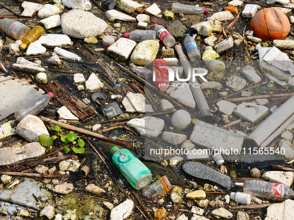 A small amount of floating objects is seen in the backbend of part of the Three Gorges Reservoir in Yichang, Hubei province, China, on Septe...