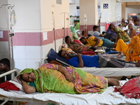 Patients suffering from dengue fever receive treatment inside the Mugdha General Hospital's admission section in Dhaka, Bangladesh, on Septe...