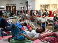 Patients suffering from dengue fever receive treatment inside the Mugdha General Hospital's admission section in Dhaka, Bangladesh, on Septe...