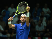 Matteo Berrettini (ITA) is in action during the 2024 Davis Cup Finals Group Stage Bologna match between Italy and Brazil at Unipol Arena in...