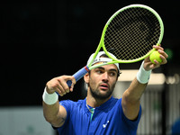 Matteo Berrettini (ITA) is in action during the 2024 Davis Cup Finals Group Stage Bologna match between Italy and Brazil at Unipol Arena in...