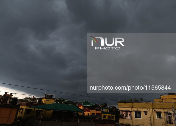 Dark rain clouds loom over the skyline in Siliguri, India, on September 11, 2024. 