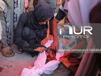 Palestinians mourn 6-year-old Palestinian girl Fatmah Juma, who is killed by an Israeli airstrike that hits their family house in Bureij Cam...