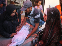 Palestinians mourn 6-year-old Palestinian girl Fatmah Juma, who is killed by an Israeli airstrike that hits their family house in Bureij Cam...