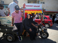 People perform a funeral prayer near the body of 6-year-old Palestinian girl Fatmah Juma, who is killed by an Israeli airstrike that hits th...