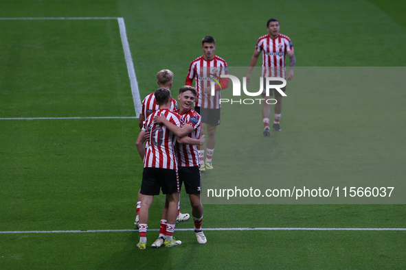 Sunderland players celebrate their opening goal during the Premier League International Cup Group B match between Sunderland and Athletic Cl...