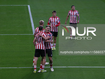 Sunderland players celebrate their opening goal during the Premier League International Cup Group B match between Sunderland and Athletic Cl...