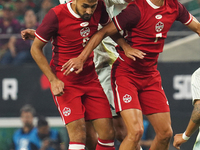 Estephen Eustaquio #7 and Mathieu Choiniere #8 of Canada jump for the header during the international friendly match between Mexico and Cana...