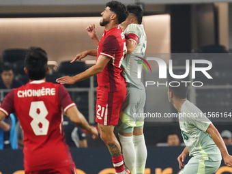 Jonathan Osorio #21 of Canada and Johan Vasquez #5 of Mexico jump for the header during the international friendly match between Mexico and...