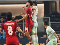 Jonathan Osorio #21 of Canada and Johan Vasquez #5 of Mexico jump for the header during the international friendly match between Mexico and...