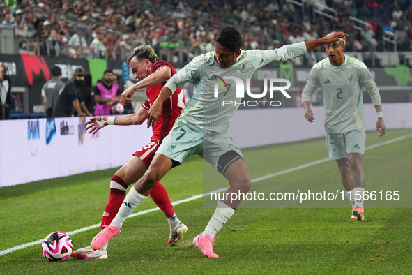 Liam Millar #23 of Canada and Luis Romo #7 of Mexico battle for the ball during the international friendly match between Mexico and Canada a...