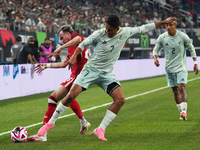 Liam Millar #23 of Canada and Luis Romo #7 of Mexico battle for the ball during the international friendly match between Mexico and Canada a...