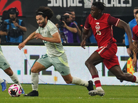 Cesar Huerta #21 of Mexico drives the ball forward during the international friendly match between Mexico and Canada at AT&T Stadium in Mexi...