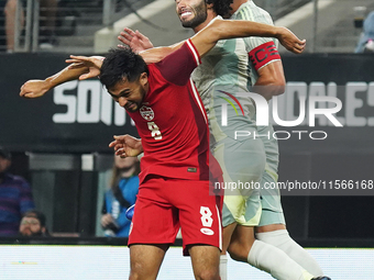 Cesar Huerta #21 of Mexico and Mathieu Choiniere #8 of Canada battle for the header during the international friendly match between Mexico a...