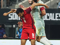 Cesar Huerta #21 of Mexico and Mathieu Choiniere #8 of Canada battle for the header during the international friendly match between Mexico a...